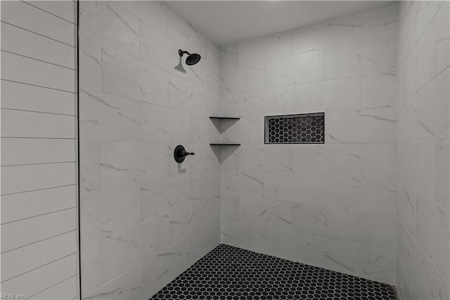 full bathroom featuring tiled shower