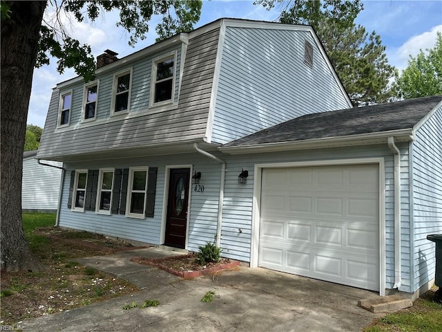 420 Cottonwood St, Newport News, VA 23608 - view of front facade featuring a chimney, concrete driveway, and an attached garage