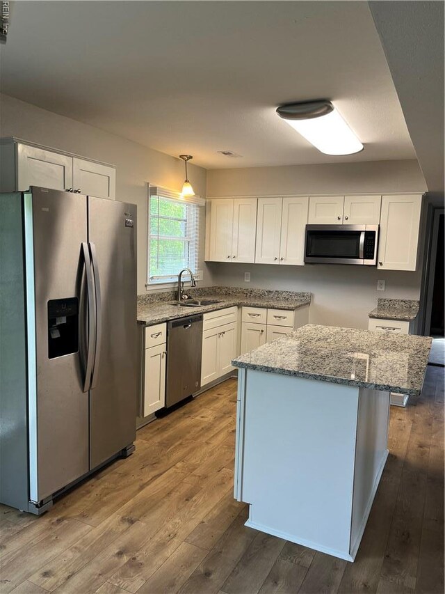 420 Cottonwood St, Newport News, VA 23608 - kitchen with light stone countertops, a sink, appliances with stainless steel finishes, and white cabinetry