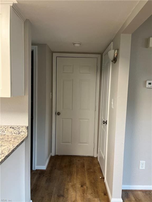 420 Cottonwood St, Newport News, VA 23608 - hall with baseboards and dark wood-type flooring