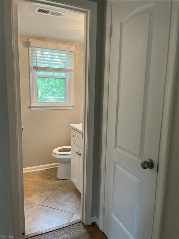 420 Cottonwood St, Newport News, VA 23608 - bathroom with visible vents, baseboards, toilet, vanity, and tile patterned flooring