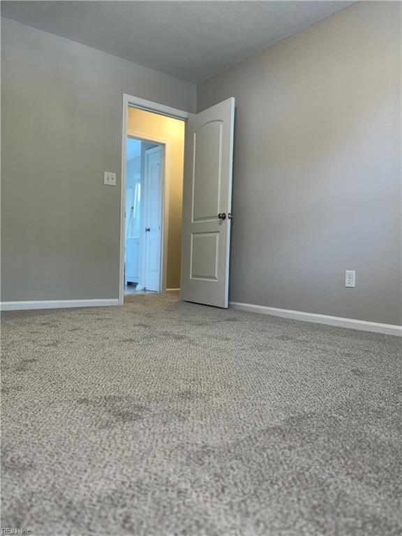 420 Cottonwood St, Newport News, VA 23608 - carpeted spare room with baseboards