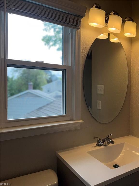 420 Cottonwood St, Newport News, VA 23608 - half bathroom with toilet, a wealth of natural light, and vanity