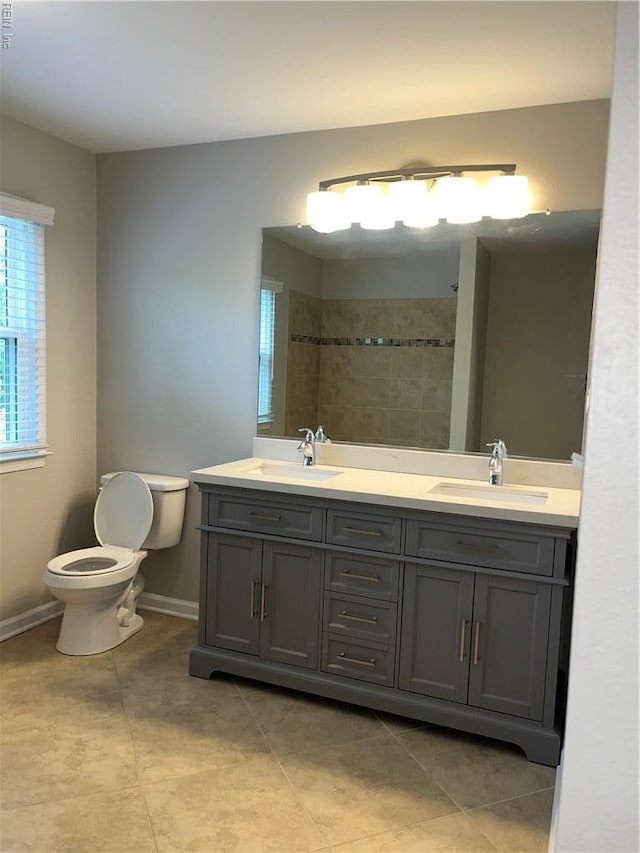 420 Cottonwood St, Newport News, VA 23608 - full bath featuring double vanity, toilet, tile patterned flooring, and a sink