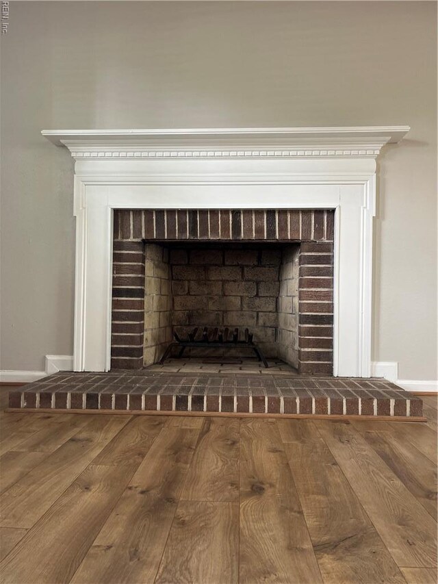 420 Cottonwood St, Newport News, VA 23608 - interior details with wood finished floors, baseboards, and a brick fireplace
