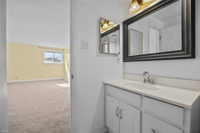 bathroom featuring baseboards and vanity