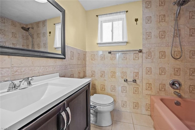 full bath featuring tile patterned flooring, bathing tub / shower combination, toilet, vanity, and tile walls