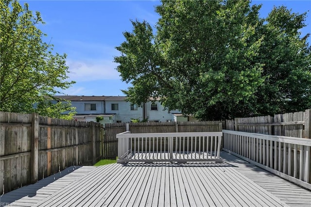 wooden deck featuring a fenced backyard