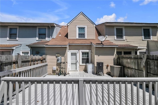 back of house featuring a fenced backyard and a wooden deck