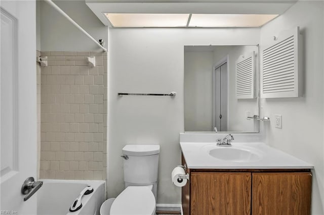 full bath with toilet, vanity, and  shower combination