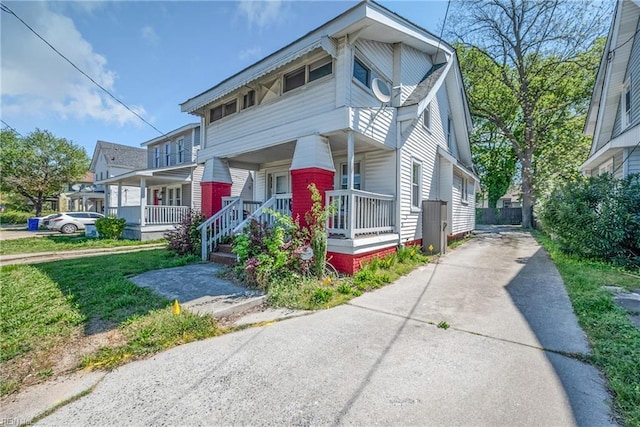 view of front of home with covered porch and concrete driveway