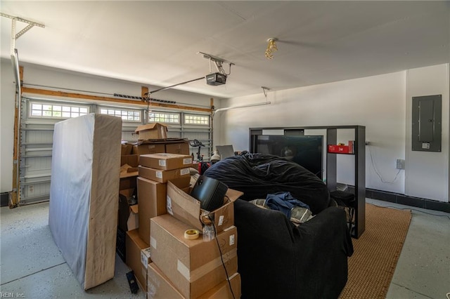 garage with electric panel and a garage door opener