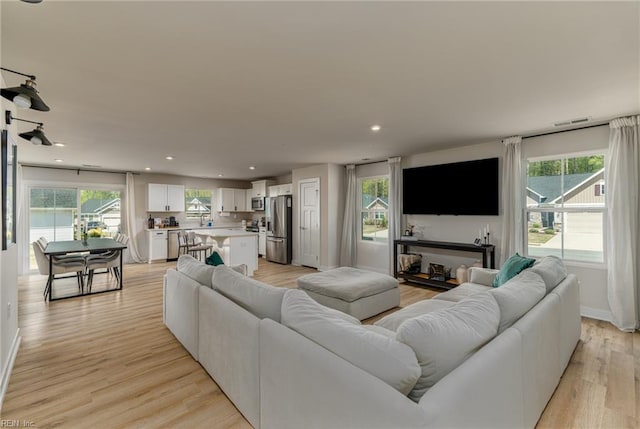 living area with a wealth of natural light and recessed lighting