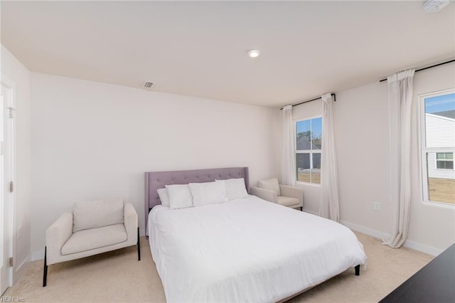 bedroom with recessed lighting, light carpet, visible vents, and baseboards