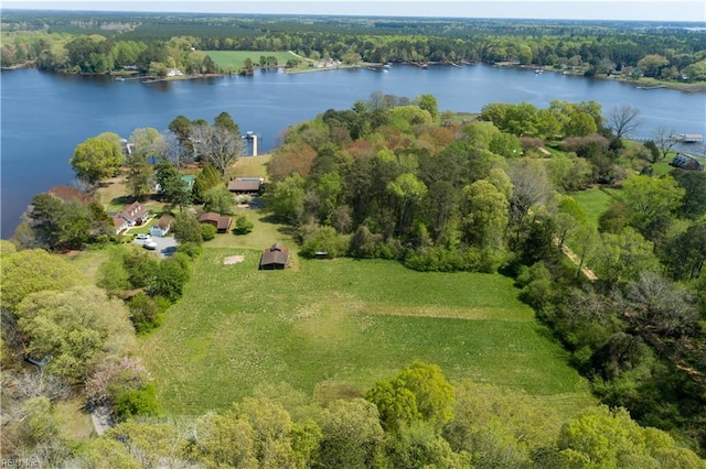 aerial view featuring a water view and a wooded view