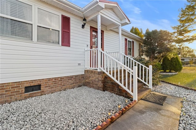 view of exterior entry featuring crawl space