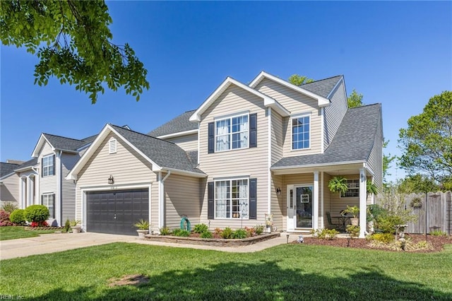 traditional-style home featuring fence, a front lawn, concrete driveway, an attached garage, and roof with shingles