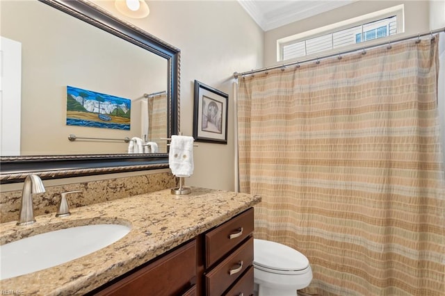 full bathroom featuring crown molding, vanity, and toilet
