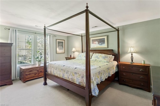 bedroom with light carpet and ornamental molding