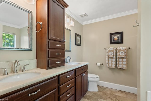 full bath with toilet, a sink, and crown molding