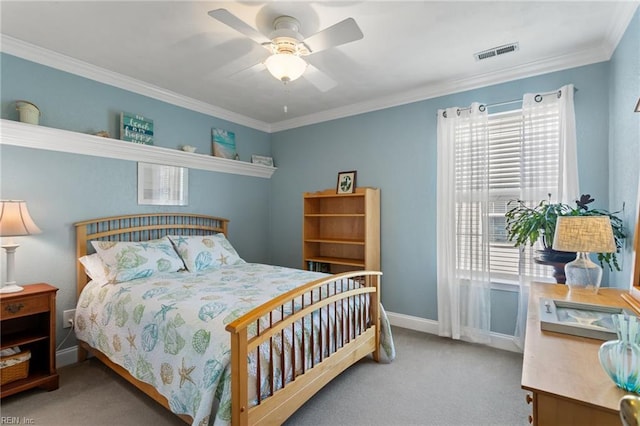 bedroom with visible vents, carpet floors, crown molding, baseboards, and ceiling fan