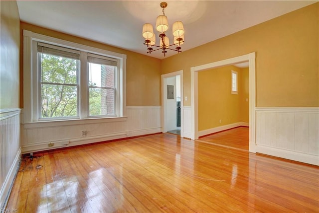 3719 Granby St Unit C-3, Norfolk, VA 23504 - interior space with a notable chandelier, a wainscoted wall, electric panel, and light wood-type flooring