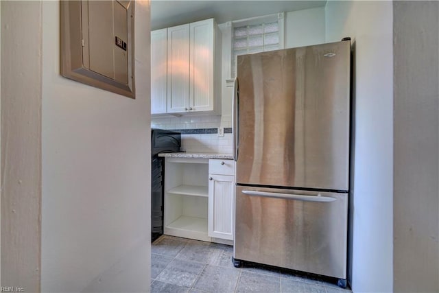 3719 Granby St Unit C-3, Norfolk, VA 23504 - kitchen featuring white cabinets, electric panel, freestanding refrigerator, and decorative backsplash