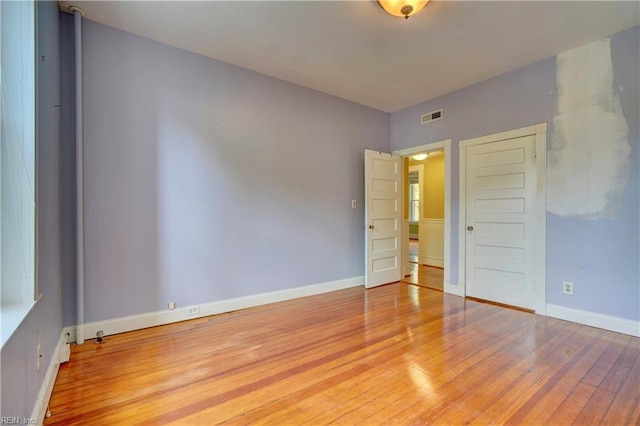 3719 Granby St Unit C-3, Norfolk, VA 23504 - unfurnished bedroom with baseboards, wood finished floors, and visible vents
