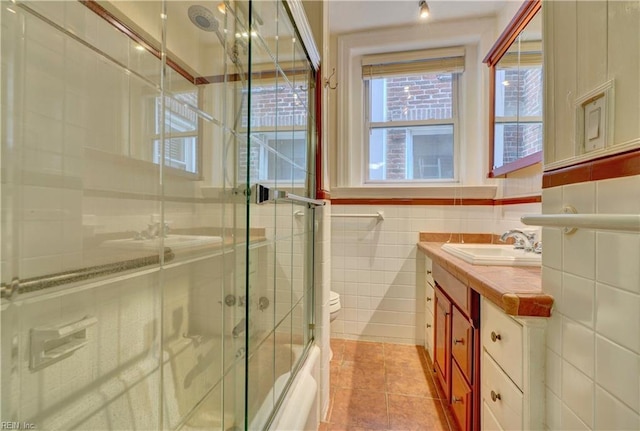 3719 Granby St Unit C-3, Norfolk, VA 23504 - full bath featuring tile patterned flooring, a shower with door, toilet, vanity, and tile walls