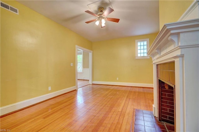 3719 Granby St Unit C-3, Norfolk, VA 23504 - unfurnished living room featuring wood finished floors, ceiling fan, a fireplace, baseboards, and visible vents
