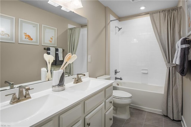 full bathroom with toilet, tile patterned floors, shower / tub combo with curtain, and a sink