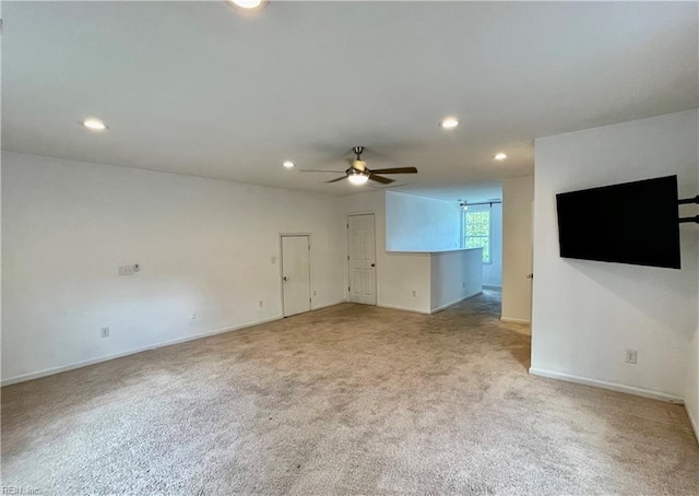 empty room featuring recessed lighting, a ceiling fan, and light colored carpet
