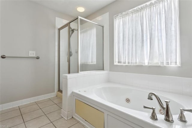 full bathroom with plenty of natural light, a whirlpool tub, tile patterned flooring, and a shower stall