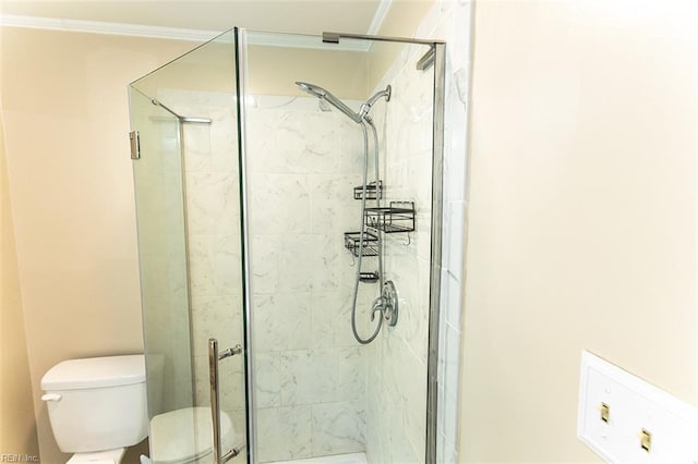 full bath with toilet, ornamental molding, and a stall shower