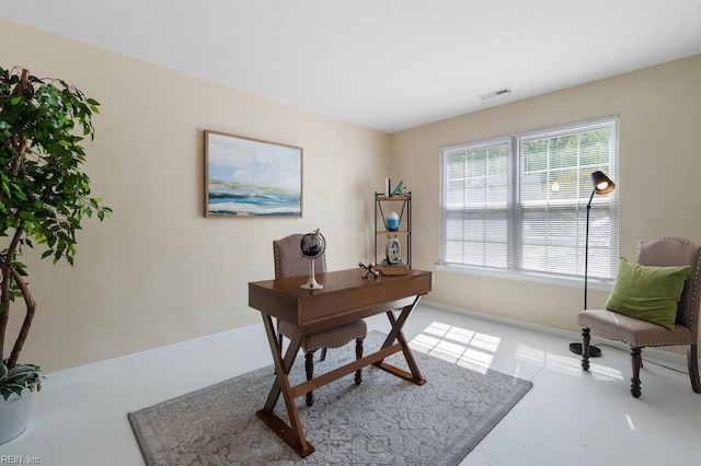 home office featuring baseboards and visible vents