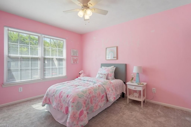 bedroom with baseboards, carpet floors, and ceiling fan
