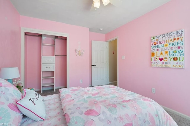 bedroom with carpet, a closet, a ceiling fan, and baseboards