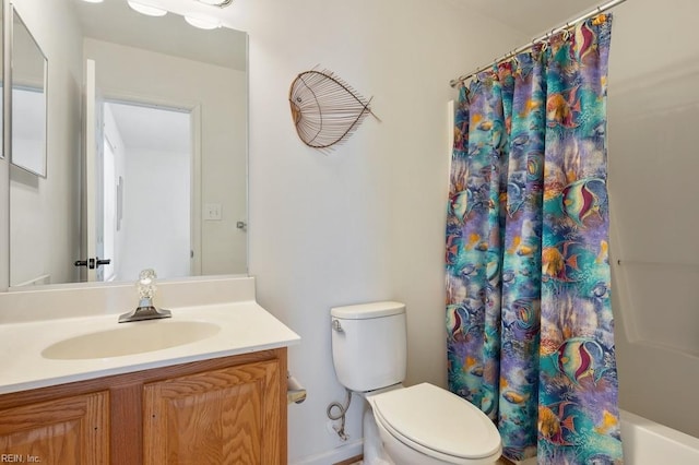 bathroom featuring toilet and vanity
