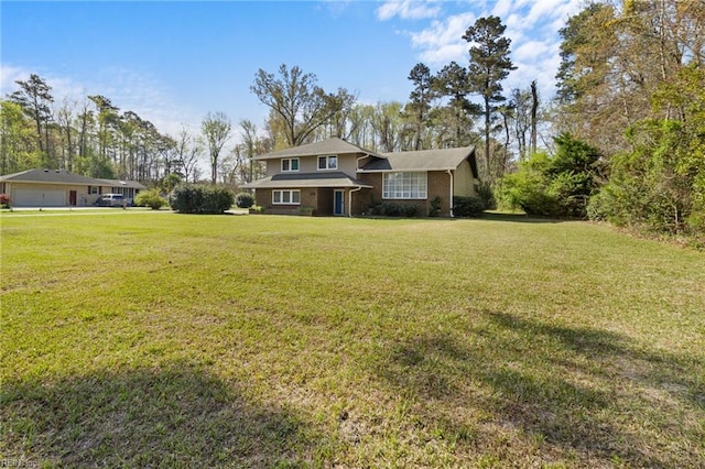tri-level home with a front yard
