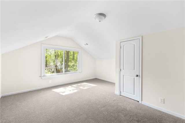 bonus room featuring vaulted ceiling, carpet, visible vents, and baseboards