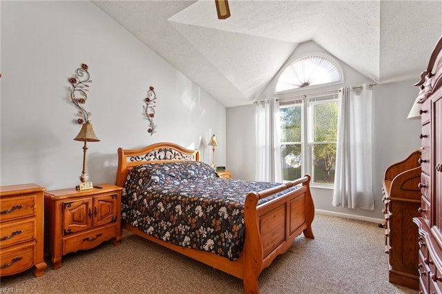 bedroom with lofted ceiling, a textured ceiling, light colored carpet, and ceiling fan