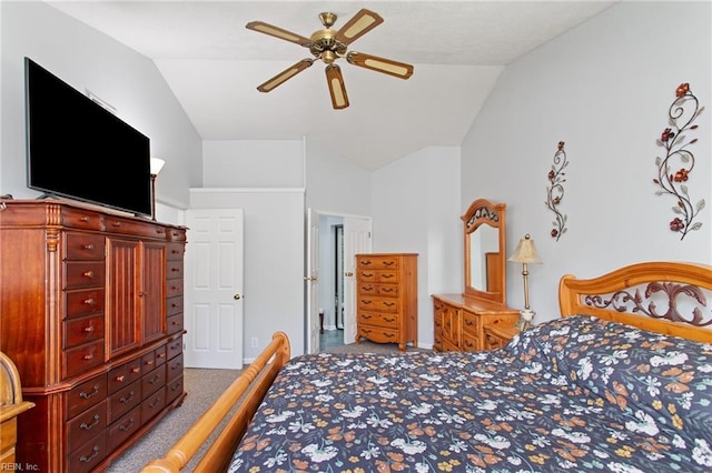 carpeted bedroom with vaulted ceiling, baseboards, and ceiling fan