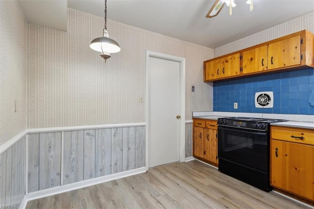 423 Galveston Ct, Hampton, VA 23669 - kitchen with light wood-type flooring, brown cabinets, and black stove