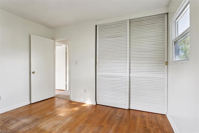 423 Galveston Ct, Hampton, VA 23669 - unfurnished bedroom featuring wood finished floors, baseboards, and a closet