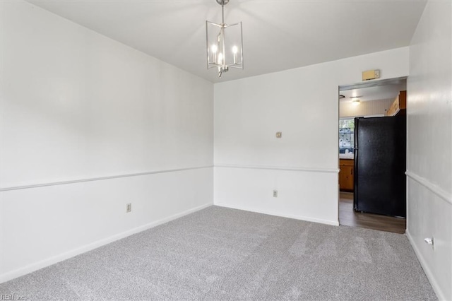 423 Galveston Ct, Hampton, VA 23669 - carpeted empty room with baseboards and an inviting chandelier