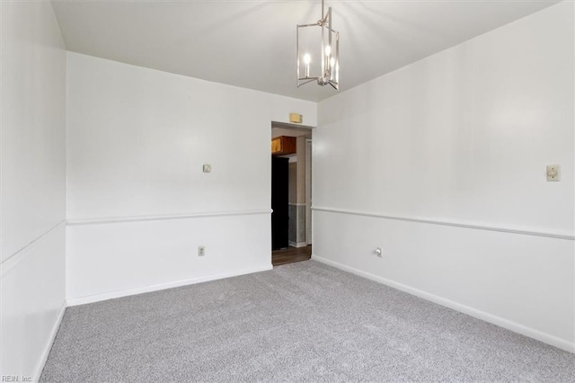 423 Galveston Ct, Hampton, VA 23669 - carpeted empty room featuring baseboards and a notable chandelier