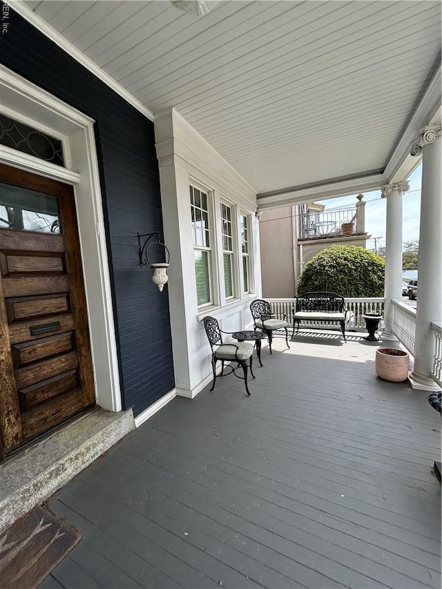wooden deck with a porch