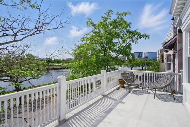 balcony featuring a water view