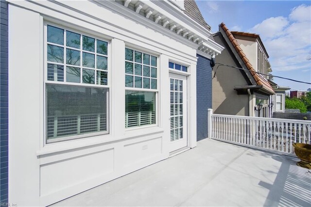 doorway to property featuring a patio area