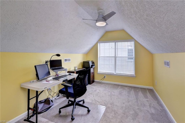 office area featuring ceiling fan, carpet floors, a textured ceiling, and baseboards
